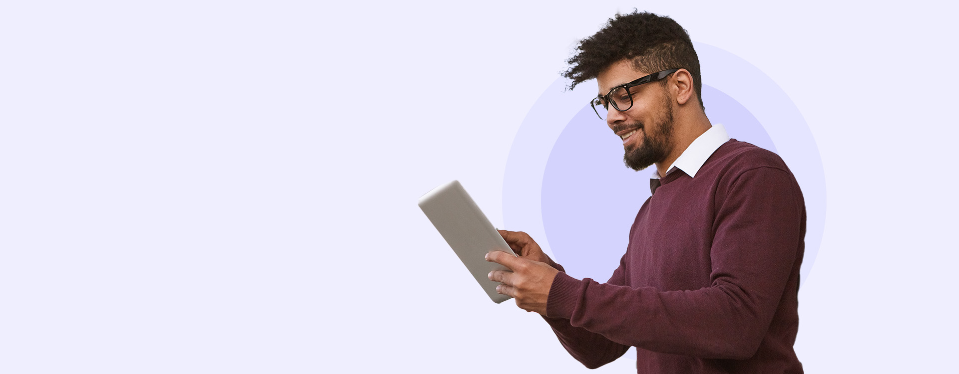 A confident professional man using a tablet, symbolizing VanderHouwen's Job Interview Guidebook, offering expert advice and essential tips to help candidates ace their next interview.